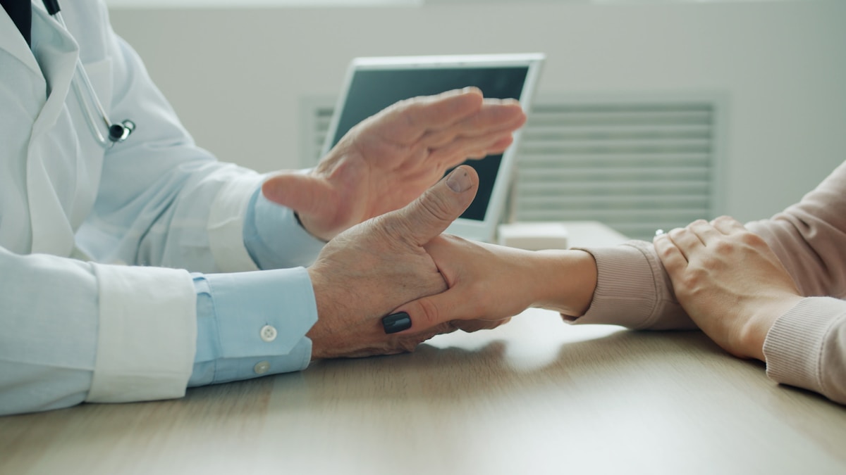 Doctor supporting a patient during consultation